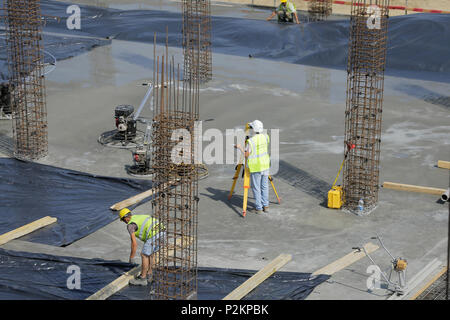 BUCHAREST, ROMANIA - JUNE 14, 2018: Cadastral engineer conducting land management expertise on a construction site Stock Photo