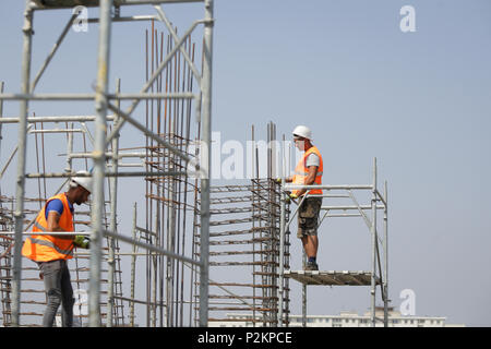 BUCHAREST, ROMANIA - JUNE 14, 2018: Workers on a construction site Stock Photo