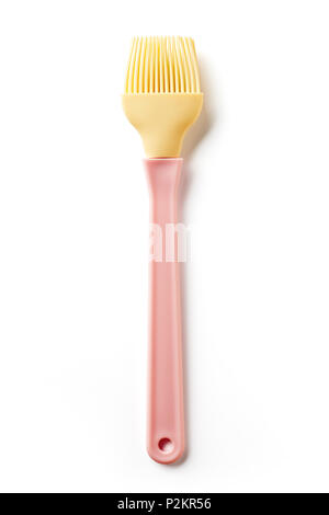 Pink and yellow silicone pastry brush isolated on white background, top view Stock Photo
