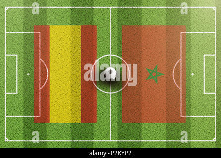 top view of green soccer field with flags of Spain and Morocco Stock Photo