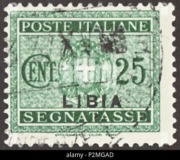 . Stamp of Italian-Libya; 1934; postage-due stamp (Italian: 'Segnatasse') in the drawing of a central Savoy coat of arms in standing oval with two lateral 'Fascio' as ornament; postage due stamp of Italy from 1943 with overprint 'LIBIA'; postmarked Stamp: Michel: No. P15 (= Italy No. P27 from 1934 with overprint); Yvert & Tellier: No. TT15; Scott: No. J15 Color: green Watermark: Italy No. 1 (crown) Nominal value: 25 Cent. (Centesimi) Postage validity: from 12 May 1934 until February 1943 Stamp picture size (printed area without below name line): 21.0 x 17.0 mm . 12 May 1934. Poste del Regno d' Stock Photo