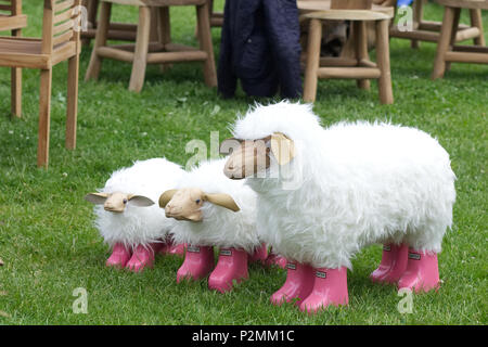 tree decorative sheep in pink wellington boots Stock Photo