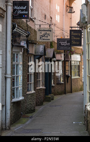 a row of attractive unique boutique style shops in watchbell lane in the centre of the town of Newport on the isle of wight. shopping on the island. Stock Photo