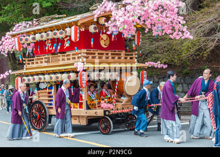 Decorated festival wagon with girls playing music during