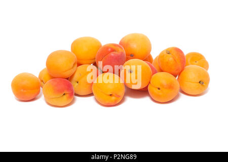 View of tasty Armenian plums (Prunus armeniaca) over a white wooden background. Stock Photo