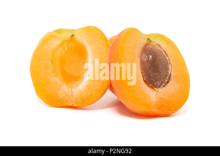 View of tasty Armenian plums (Prunus armeniaca) over a white wooden background. Stock Photo