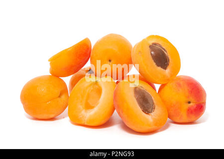 View of tasty Armenian plums (Prunus armeniaca) over a white wooden background. Stock Photo