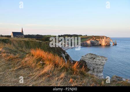 France, Seine Maritime, Pays de Caux, Cote d'Albatre (Alabaster Coast), Etretat, Notre Dame de la Garde chapel, protector of the fishermen, perched on Amont cliff and Aval cliff in the background Stock Photo