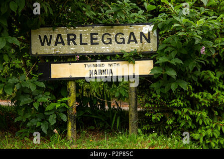 UK, Cornwall, Bodmin Moor, Warleggan village sign with unofficial  ‘Twinned with Narnia’ addition Stock Photo