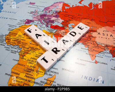 representation of fair trade, to help producers in developing countries achieve better trading conditions, on world map background Stock Photo