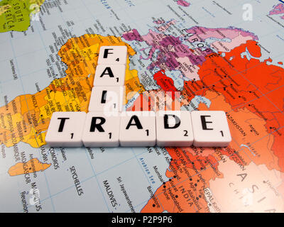 representation of fair trade, to help producers in developing countries achieve better trading conditions, on world map background Stock Photo