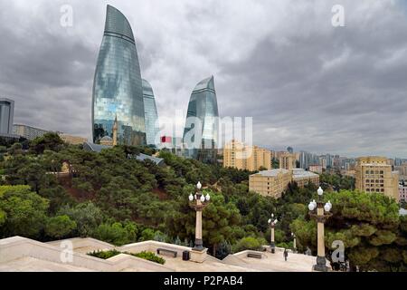 Azerbaijan, Baku, Flame Towers by architects Hellmuth, Obata & Kassabaum and the Shehidler Mosque at his feet, staircase that leads to the Martyrs Memorial in the foreground Stock Photo