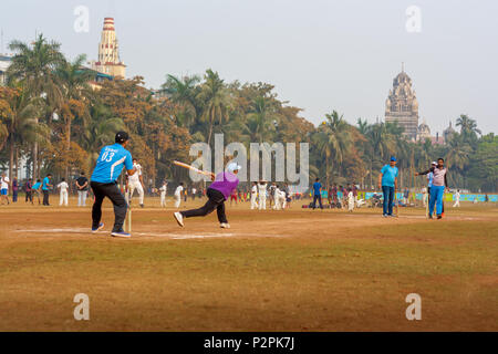 MUMBAI, INDIA - JANUARY 14, 2017 : Men playing cricket with tennis ball at Mumbai grounds Stock Photo