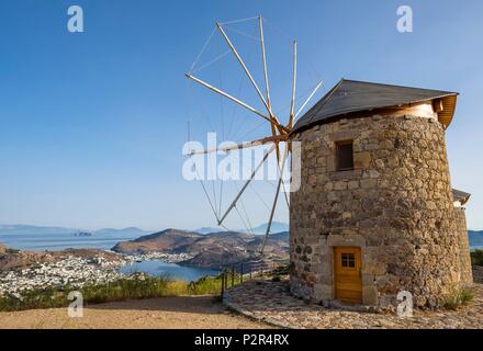 Greece, Dodecanese archipelago, Patmos island, Skala, main harbour of the island seen from Chora windmills Stock Photo