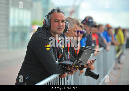 Royal Victoria Dock, London, UK. 16th Jun, 2018. Technical staff from Team Sweden watching a Formula 1 powerboat free practice session during the UIM F1H2O World Championship, Royal Victoria Dock, London, UK.  The UIM F1H2O World Championship is a series of international powerboat racing events, featuring single-seater, enclosed cockpit, catamarans which race around an inshore circuit of around 2km at speeds of up to 136mph/220kmh. Credit: Michael Preston/Alamy Live News Stock Photo