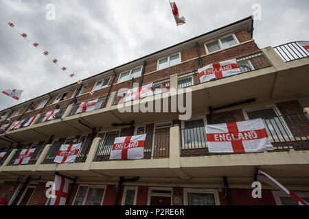 London, UK. 16th June 2018. Patriotic residents on the Kirby Estate in Bermondsey celebrate 2018 FIFA World Cup fever by covering their estate with over 300 St. George red and white flags to cheer on England in the biggest football tournament in the world which kicked off in Russia this week. Credit: Guy Corbishley/Alamy Live News Stock Photo