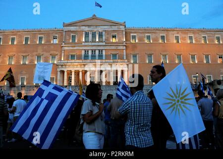 Demonstrators seen holding flags in front of the Greek parliament building. Big Demonstration in Syntagma as Greeks demand from the parliament to not vote yes at an agreement about the Macedonia Naming Dispute. Credit: SOPA Images Limited/Alamy Live News Stock Photo