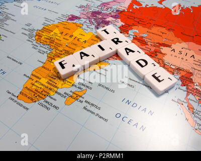 representation of fair trade, to help producers in developing countries achieve better trading conditions, on world map background Stock Photo