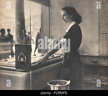 . Italian young woman at work in an ice cream parlor in Milan . 14 October 1950. Unknown 9 At work in an ice cream parlor 1950 Stock Photo