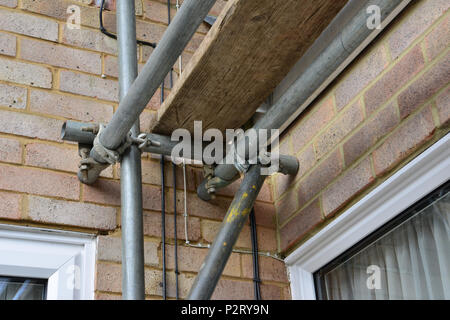 Scaffolding pipe crossing on a Scaffold tower looking up from underneath. Stock Photo