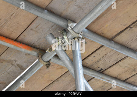 Scaffolding pipe crossing on a Scaffold tower looking up from underneath. Stock Photo