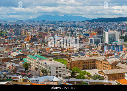 The modern part of Quito city with its skyscrapers located in the Andes mountain range, Ecuador, South America. Stock Photo