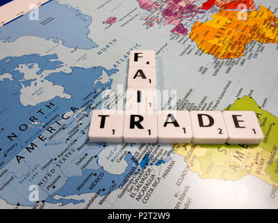 representation of fair trade, to help producers in developing countries achieve better trading conditions, on world map background Stock Photo