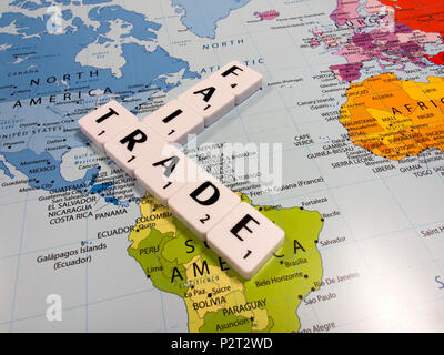 representation of fair trade, to help producers in developing countries achieve better trading conditions, on world map background Stock Photo