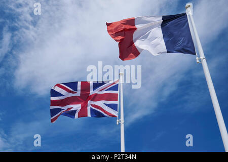 The Flags of the United Kingdom and France. The British Union Jack and the French Tricolor. Stock Photo