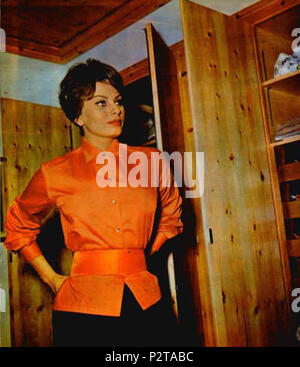 . Italian actress Sophia Loren in front of her wardrobe in her hotel room in Capri . 1959. Unknown 2 1959 Sophia Loren Stock Photo