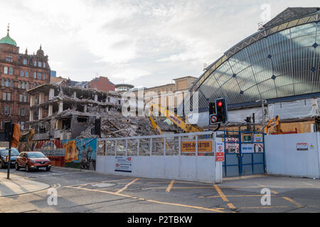 The previously hidden glass front of Glasgow Queen Street Station is visible again as the building in front is demolished Stock Photo