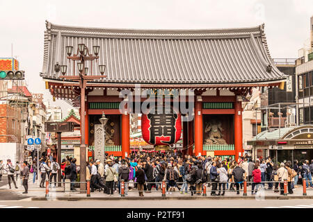 Japanese walking round in traditional kimono walking around area of  Asakusa Kannon Temple an area popular with tourist in Tokyo Japan. Stock Photo