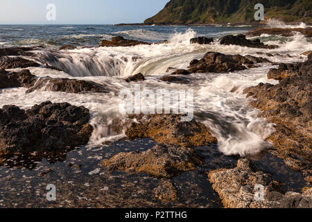 Water is drawn into Thor's Well at Cape Perpetua Scenic Area along Oregon's Central Coast south of Yachats. Stock Photo