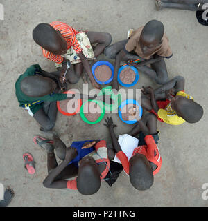 Children enjoy lunch in the Loreto Primary School in Rumbek, South Sudan. Stock Photo