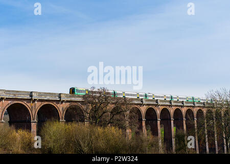 Southern train passing over the Ouse Valley Viaduct near Haywards Heath, West Sussex, England, UK on the London to Brighton line. Stock Photo