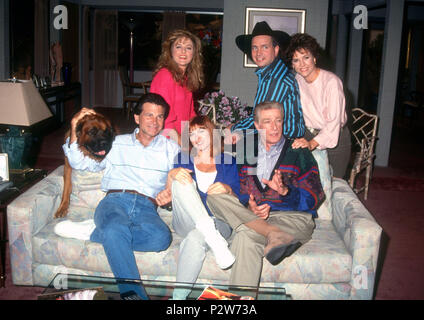 LOS ANGELES, CA - OCTOBER 15: (L-R) Bear the dog (Dreyfuss on the show), actor David Leisure, actress Park Overall, actress Dinah Manoff, actor Richard Mulligan, Recording Artist Garth Brooks and actress Kristy McNichol pose for photos on the set of 'Empty Nest' television show filming 'Country Weston' episode, which aired on November 2, 1991, at Sunset Gower Studios on October 15, 1991 in Los Angeles, California. Photo by Barry King/Alamy Stock Photo Stock Photo