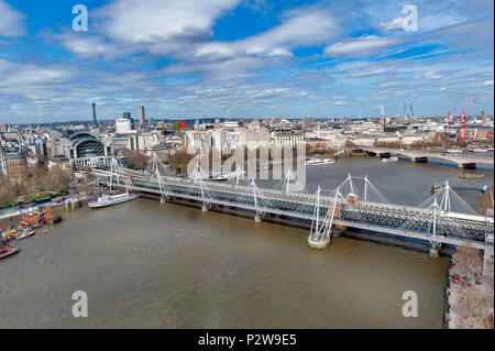 Aerial view of Hungerford Bridge, and Golden Jubilee Bridges, two cable-stayed pedestrian bridges over the River Thames in London, England, UK Stock Photo