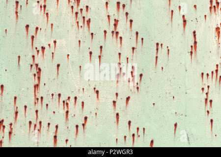 Old grungy green metal wall with rust specks, background photo texture Stock Photo