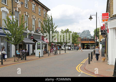 Local shops and cafes close to Wandsworth Town rail station, a fashionable area of southwest London, UK. Shows effective parking controls. Stock Photo