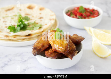 Homemade delicious food of tortillas, salsa and fried wings. Selective focus. Stock Photo