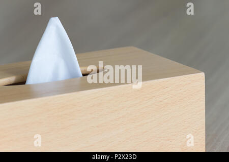 New tissue in wooden box on wood table. Stock Photo