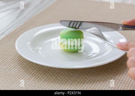Luxury afternoon tea with macaroon dessert on wooden table. Stock Photo