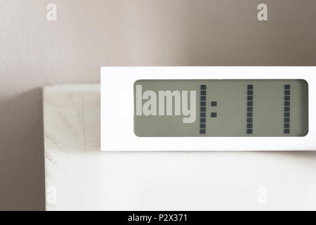 White clock digital modern on white table in bedroom. Stock Photo