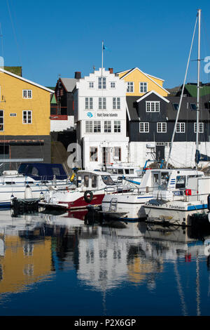Denmark, Faroe Islands, Torshavn. Capital city of Faroes. Early morning reflections in the port area of Old Town. Stock Photo