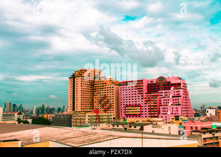 Bird view over cityscape and construction site including several cranes working on a building complex, with sun and clouds in the morning.Copy space.B Stock Photo
