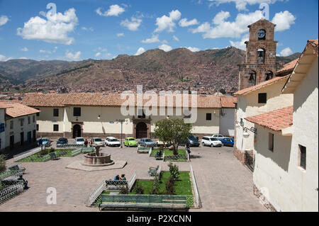 A garden square surrounded by offices and other buildings. The Church and mountains in the background. Stock Photo