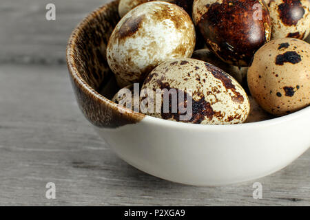 Detail on quail eggs in small bowl. Stock Photo
