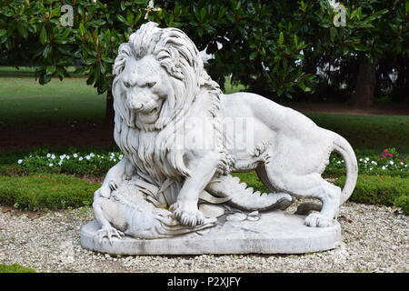 Lion fighting crocodile white statue Stock Photo