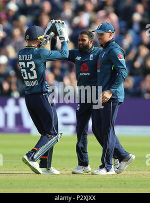 England's Adil Rashid (centre) celebrates with Jos Buttler (left) and Jason Roy (right) after taking the wicket of Australia's Aaron Finch during the One Day International match at the SSE SWALEC Stadium, Cardiff. Stock Photo