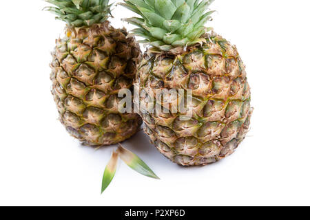 two big pineapples on a white background closeup Stock Photo